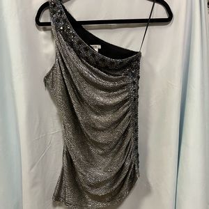 Off the shoulder top with gems & sequins along the front and side .